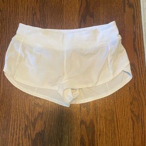 White Speed up low-rise 2.5” shorts
